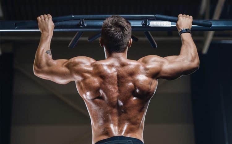 Man Doing Back Exercise In Gym